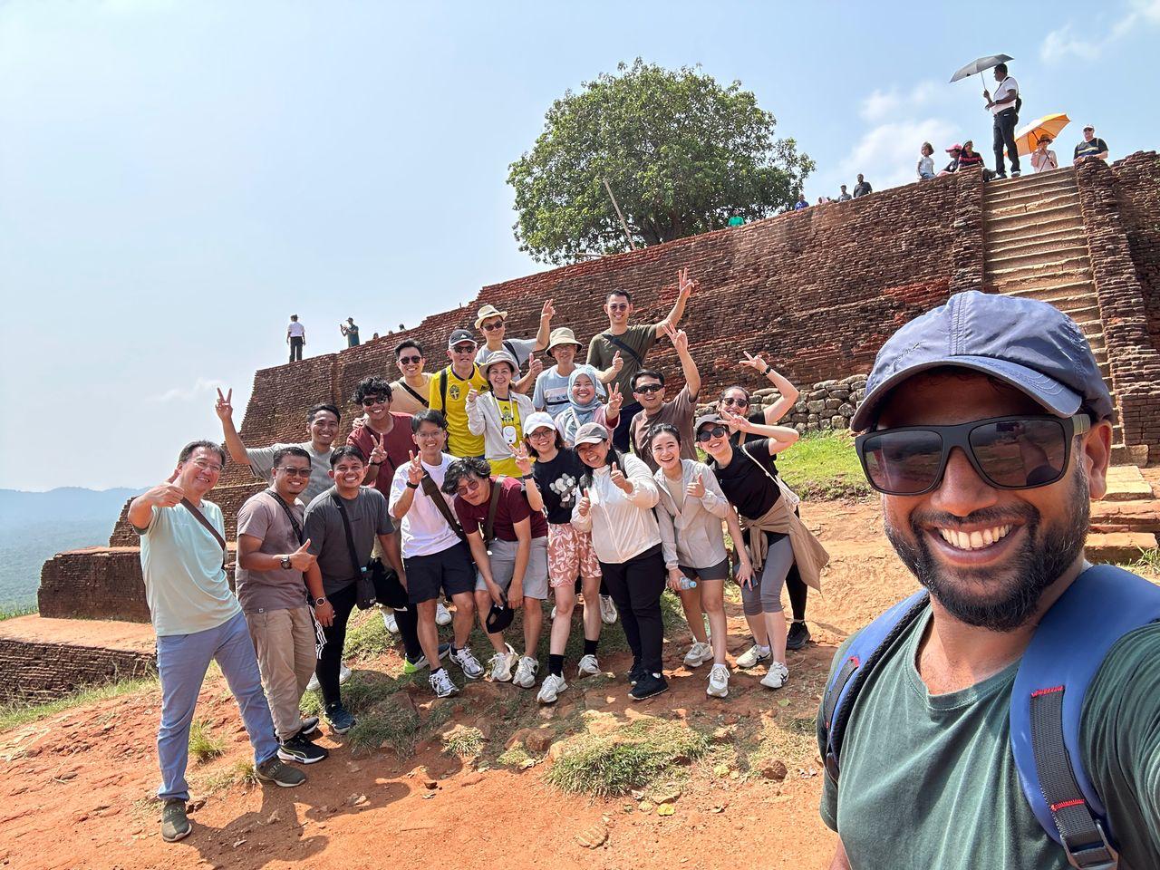 Placeholder: climbers on the Sigiriya staircase at dawn